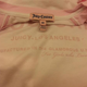 Illustration for article titled Juicy Couture Prints Manufactured in Glamorous USA on Clothing, Forgets to Remove Made in Vietnam Tags
